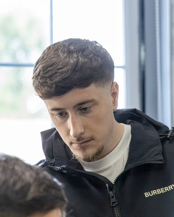 One of our barbers concentrating on a cut